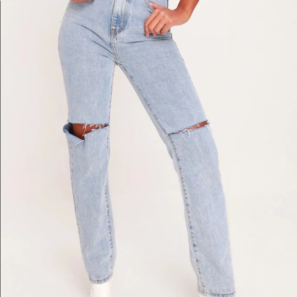 Slashed knee jeans